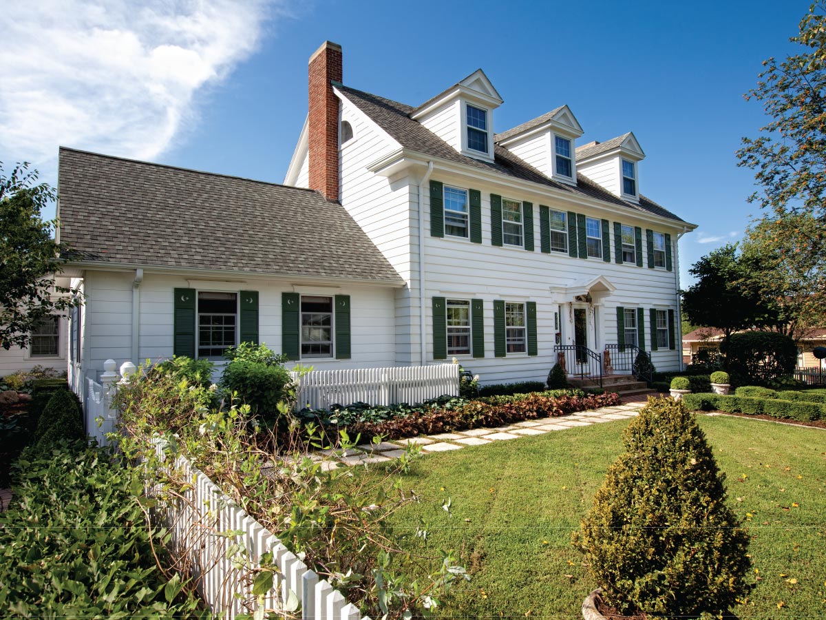 Large older house on property in a suburb.